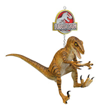Load image into Gallery viewer, Jurassic Park dinosaur toy with hanging chain on a white background