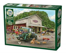 Load image into Gallery viewer, A 1000 piece Cobble Hill puzzle depicting a vintage General Store scene with a green grocer truck, chickens, bicycles, a vintage black truck, and an older gentleman with his dog.