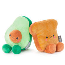 Load image into Gallery viewer, Two plush toys designed to look like an avocado and a slice of toast, with smiling faces, connected by magnets.